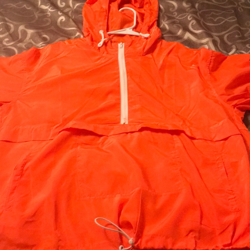 Bright orange windbreaker